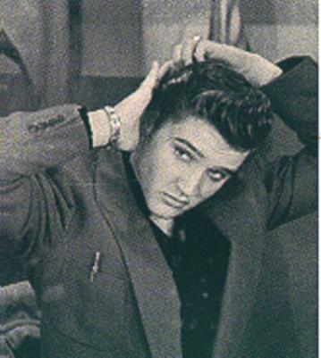 Elvis Presley pictures combing his hair